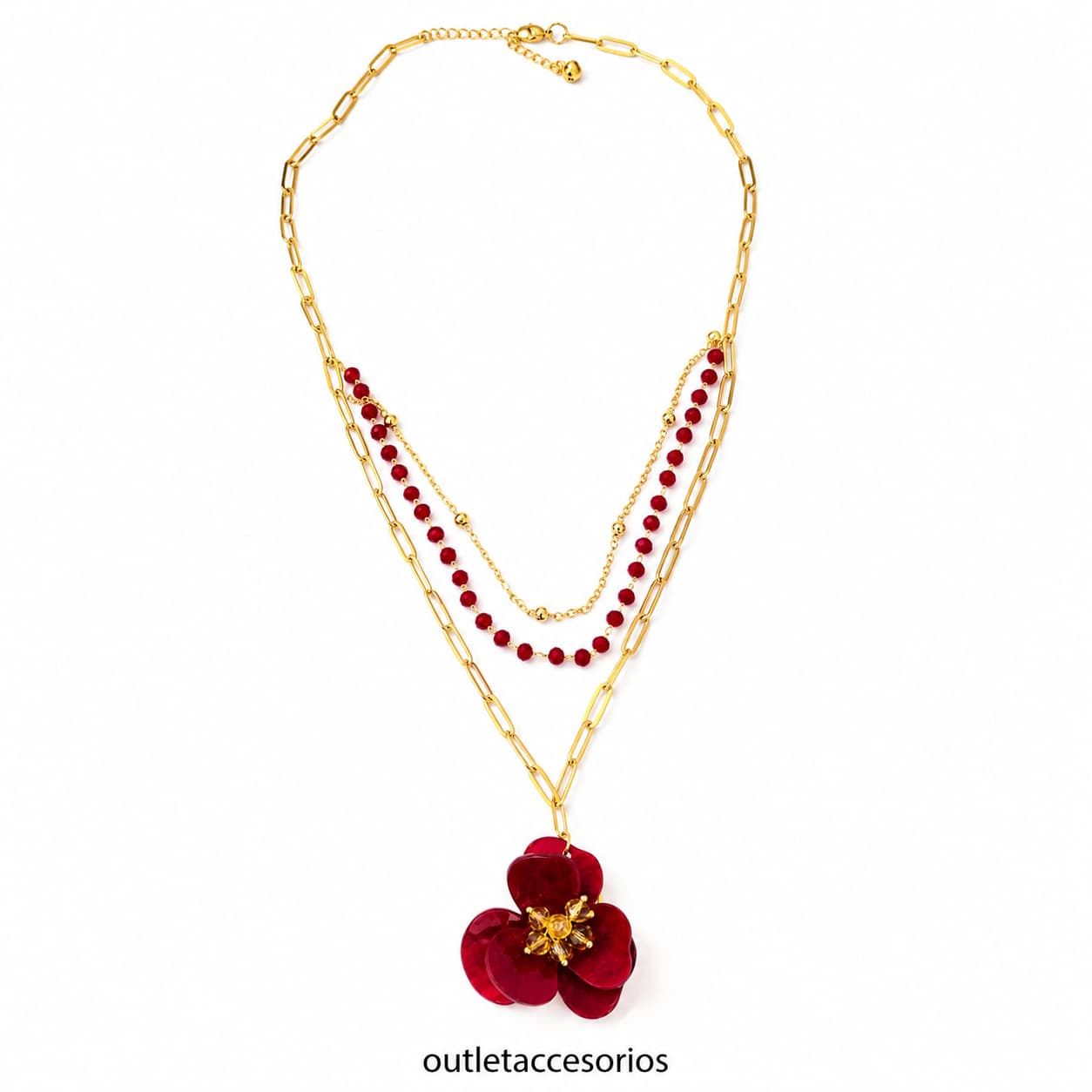 Collar dorado de acero quirúrgico con colgante de flor roja, cadenas múltiples y detalles de cristales sobre maniquí blanco.